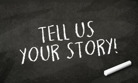 Black Chalkboard With Message Tell Us Your Story