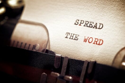Spread the word phrase written with a typewriter.
